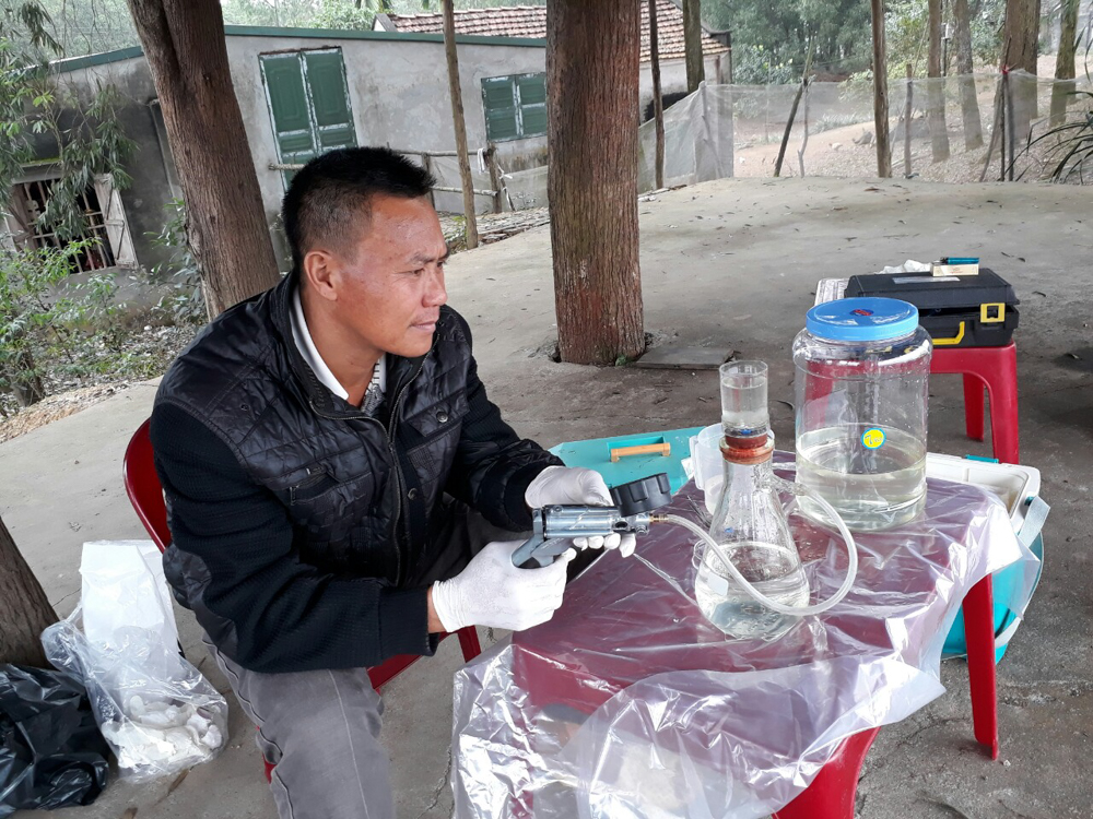 Man sampling water