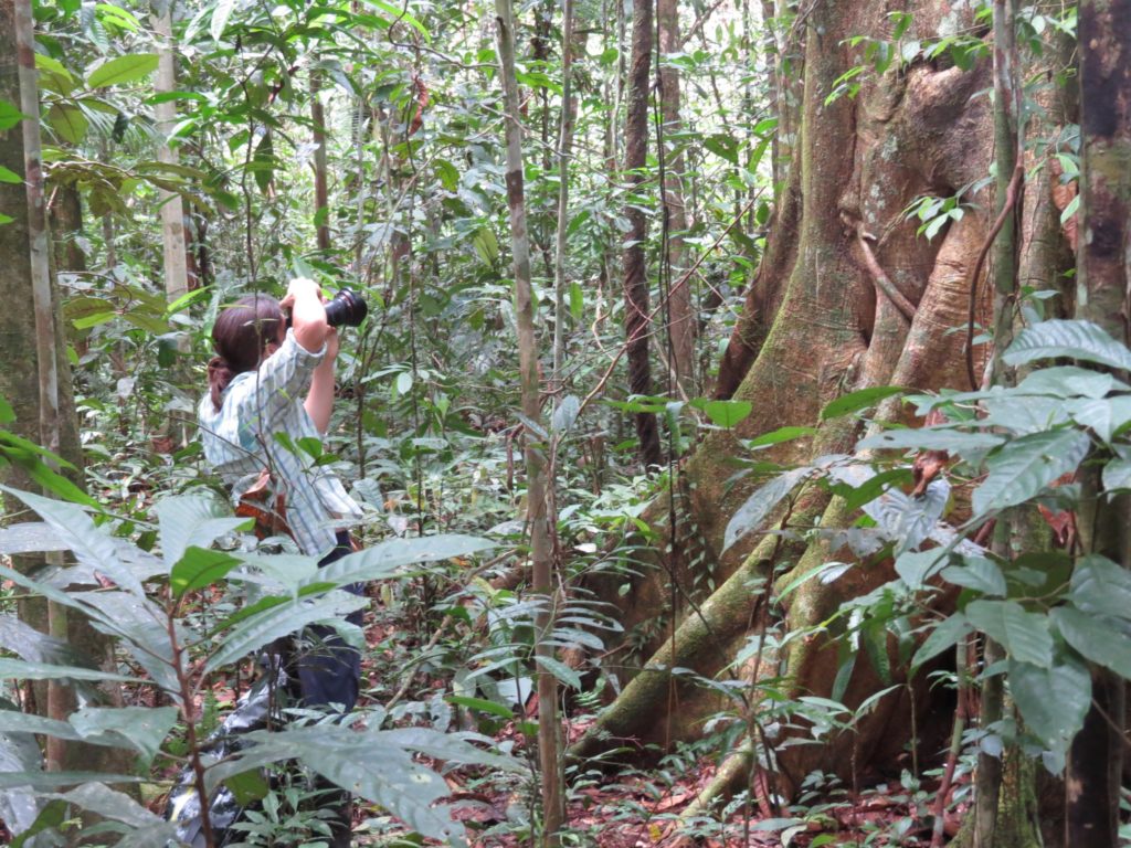 Reporter Christina Selby snapping shots in the Amazon jungles. (Photo by Laura K. Marsh)