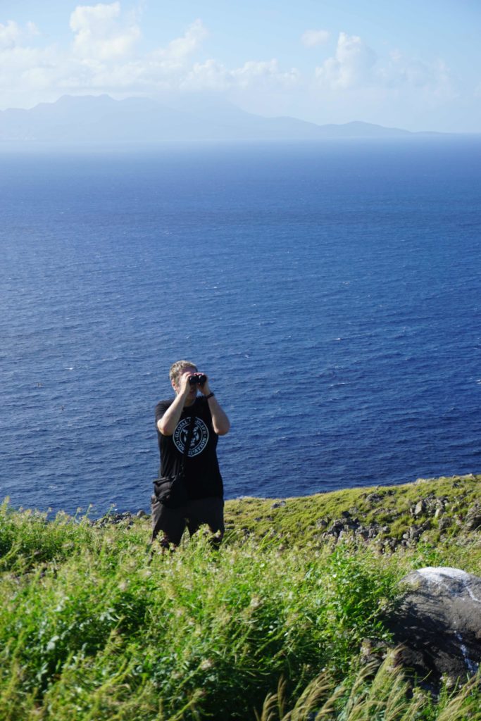 Me on Redonda Island, with Montserrat in the background. (Photo by Sophia Steele/FFI)