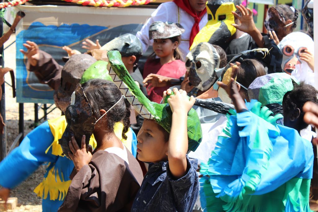 Local children celebrating the 4th brown spider monkey festival in Colombia. Photo courtesy Andres Link.
