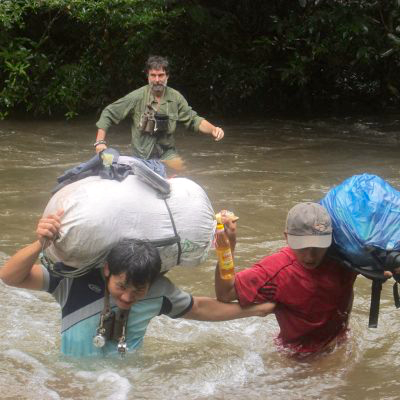 Rob Timmins, in the background, was the first to reveal the Annamite Striped Rabbit’s existence to the world. (Photo courtesy of the Saola Working Group)