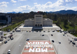 A huge banner in Tirana in Albania that says "Vjosa National Park Now."